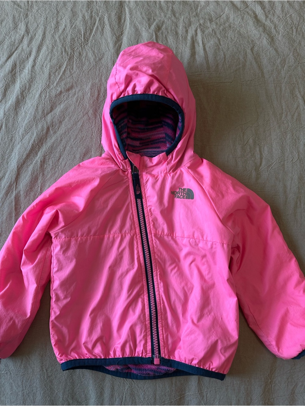 The North Face Bright Pink Hooded Kids Rain Jacket, fleeced, double sided wear.